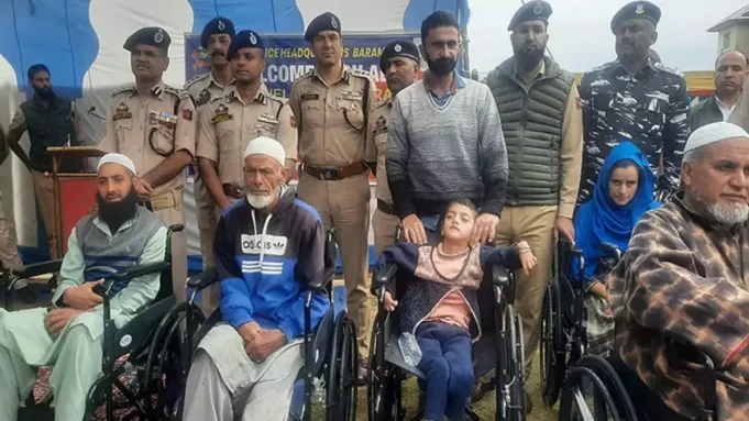 Wheelchairs are distributed to people with disabilities in Sopore